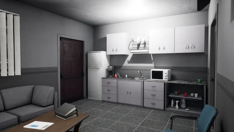 Staff kitchen with a fridge, kettle and draining board