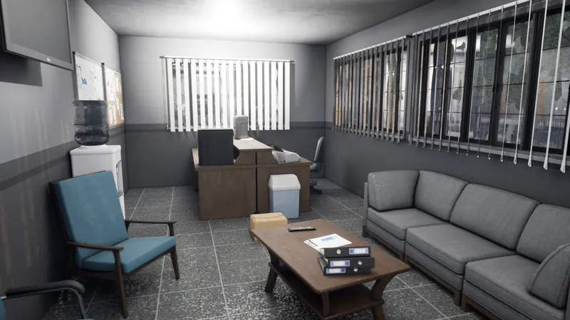 Staff lounge with a sofa and blinds over the windows